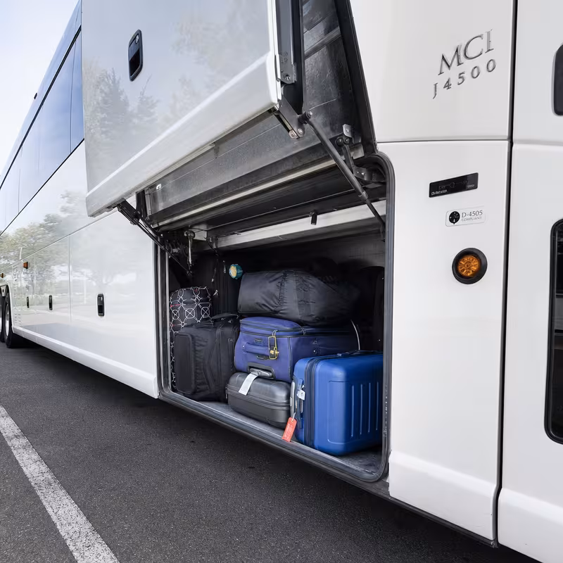Party bus interior with wraparound leather seating and LED lighting in Fort Lauderdale