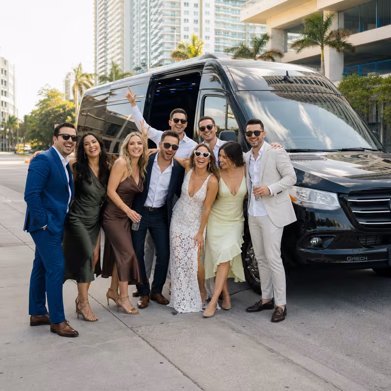 Group boarding a white charter bus for Bachelor & Bachelorette Transportation transportation in Fort Lauderdale