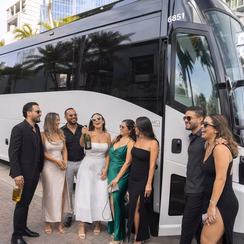 Passengers loading luggage while boarding an Fort Lauderdale group shuttle