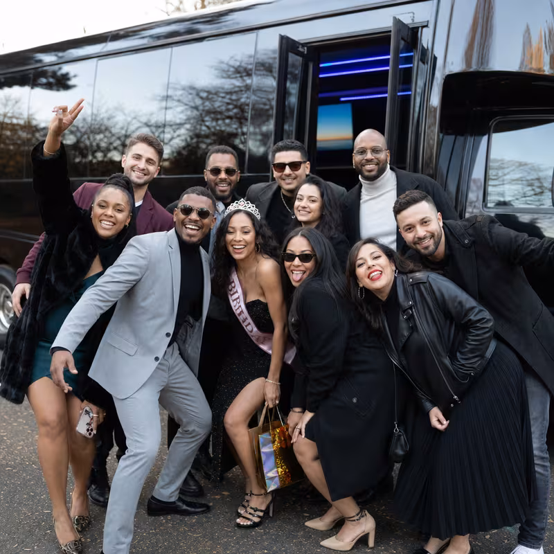 Group boarding a white charter bus for Birthday Transportation transportation in Fort Lauderdale