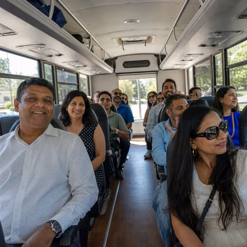 Group boarding a white charter bus for Private Event Transportation transportation in Fort Lauderdale