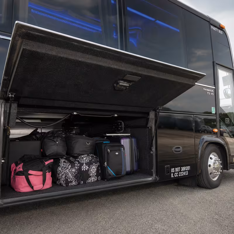 Party bus interior with wraparound leather seating and LED lighting in Fort Lauderdale