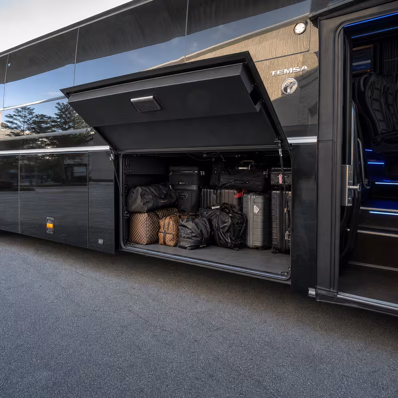 Party bus interior with wraparound leather seating and LED lighting in Fort Lauderdale