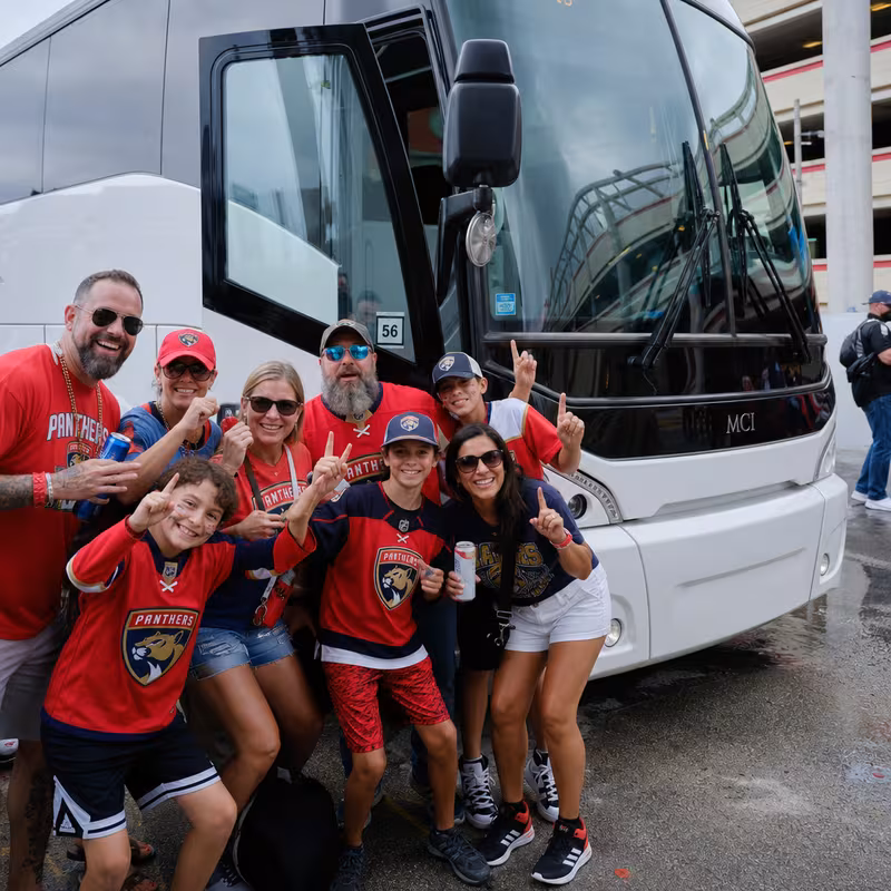 Passengers loading luggage while boarding an Fort Lauderdale group shuttle